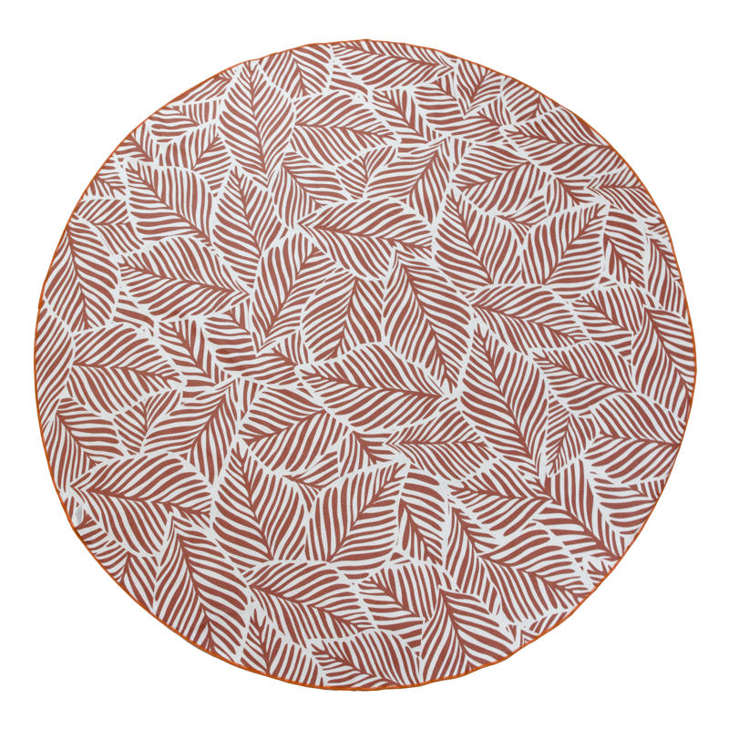 Reversible with two designs: a warm clay-toned leaf print and a bold geometric pattern.