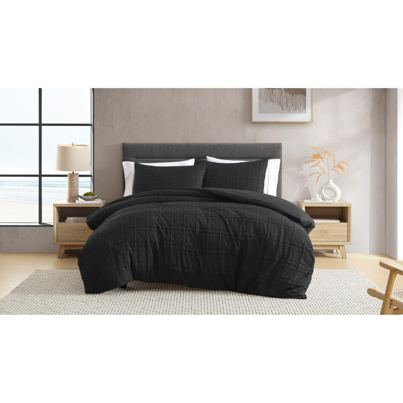 Black quilt cover set adding sleek, contemporary style to the bedroom.