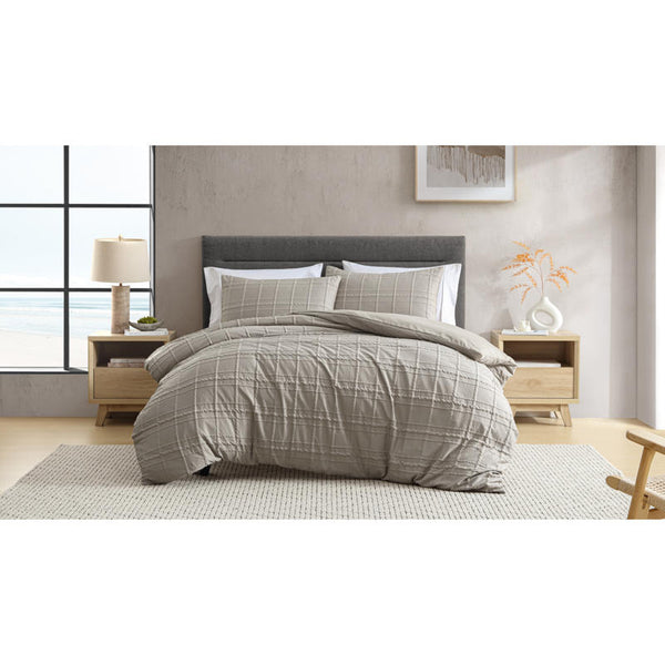 Ardor Leonard Mocha Quilt Cover Set styled on bed with stitched grid pattern and neutral tones.