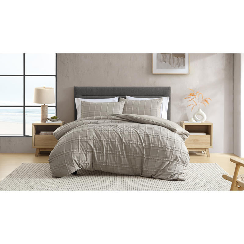 Ardor Leonard Mocha Quilt Cover Set styled on bed with stitched grid pattern and neutral tones.