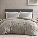 Ardor Leonard Mocha Quilt Cover Set styled on bed with stitched grid pattern and neutral tones.