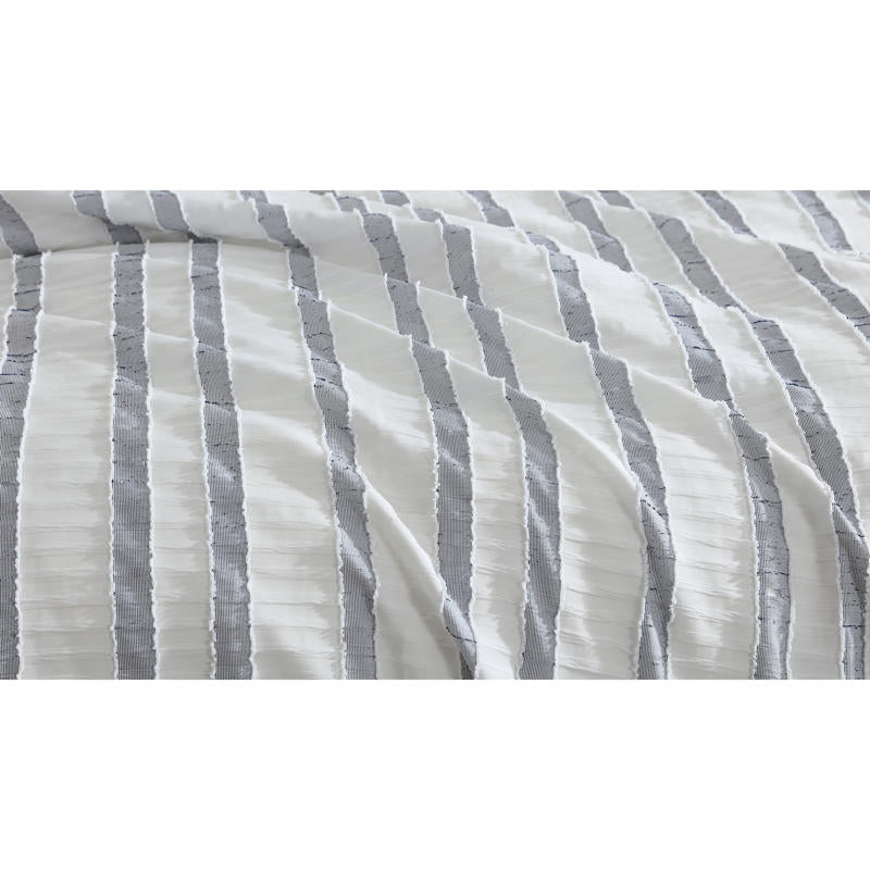 Close-up of textured blue and white stripe design on the Miles Quilt Cover fabric.
