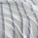Close-up of textured blue and white stripe design on the Miles Quilt Cover fabric.
