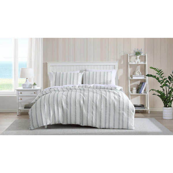Close-up of soft textured green and white stripe detailing on the Miles Quilt Cover fabric.