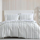 Close-up of soft textured green and white stripe detailing on the Miles Quilt Cover fabric.