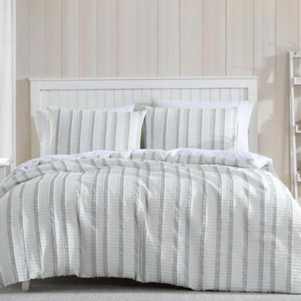 Close-up of soft textured green and white stripe detailing on the Miles Quilt Cover fabric.
