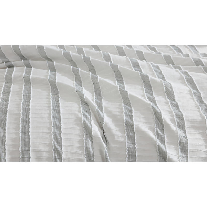 Close-up of soft textured green and white stripe detailing on the Miles Quilt Cover fabric.