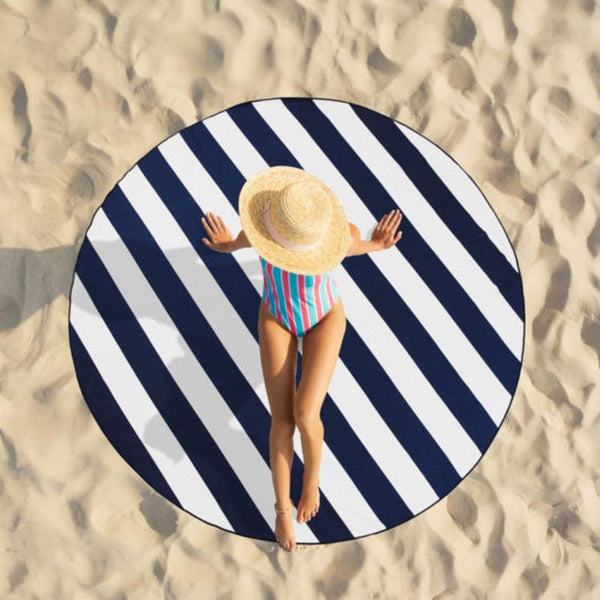 Reversible design with bold navy stripes on one side and a soft neutral leaf print on the other.