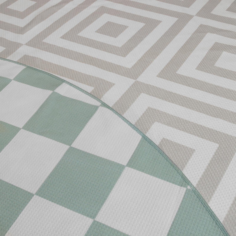 Reversible design with a chic sage check and neutral geometric pattern for two stylish looks in one.