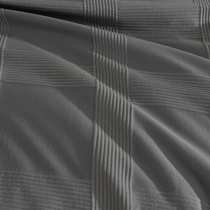 Ardor Shiloh Charcoal Textured Quilt Cover Set styled in a modern white bedroom.