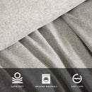 Kenneth Cole Herringbone Moss Quilt Cover Set styled on bed with neutral walls and modern décor.