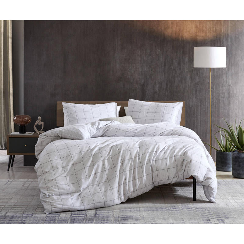 Close-up of grid pattern on Kenneth Cole Holden Grey Quilt Cover fabric.