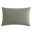 Modern interior with Kenneth Cole Nila Moss Green Quilt Cover Set on grey bedhead and neutral rug.