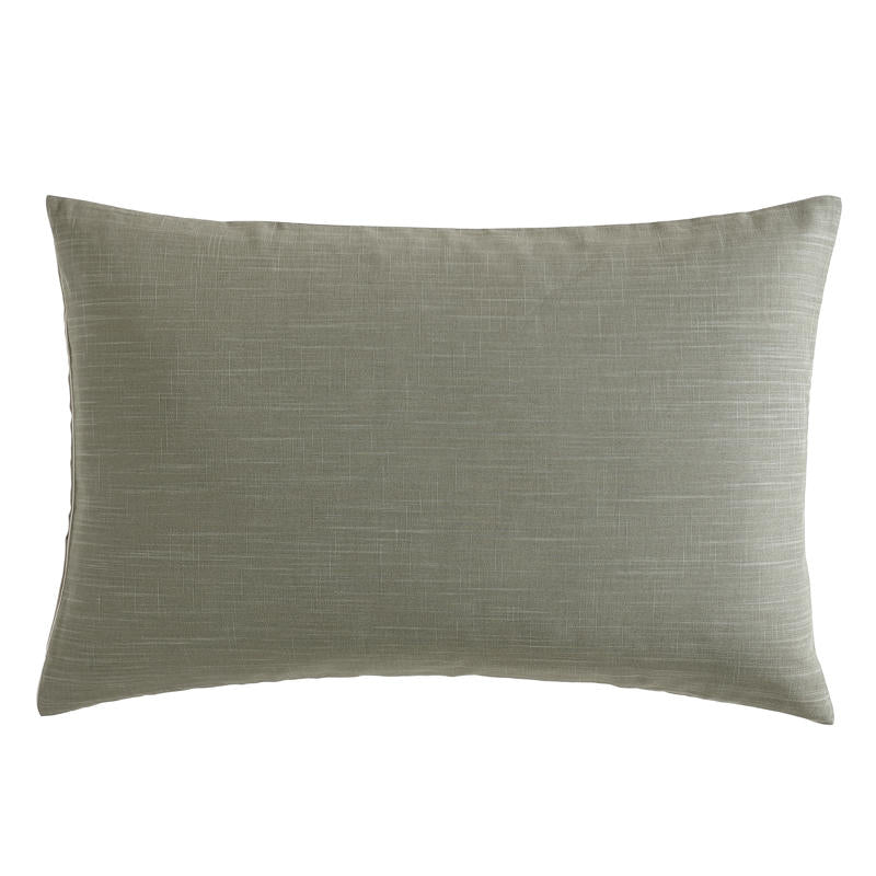 Modern interior with Kenneth Cole Nila Moss Green Quilt Cover Set on grey bedhead and neutral rug.