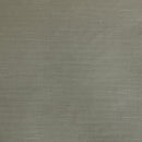 Modern interior with Kenneth Cole Nila Moss Green Quilt Cover Set on grey bedhead and neutral rug.