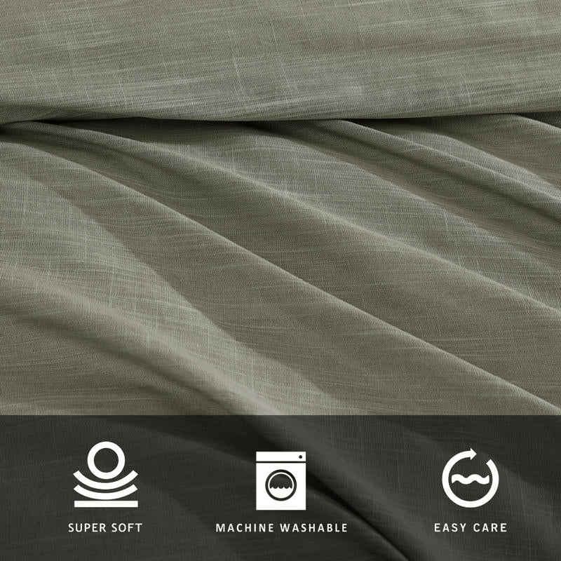 Modern interior with Kenneth Cole Nila Moss Green Quilt Cover Set on grey bedhead and neutral rug.