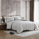 Reversible comforter showing light and dark grey tones.