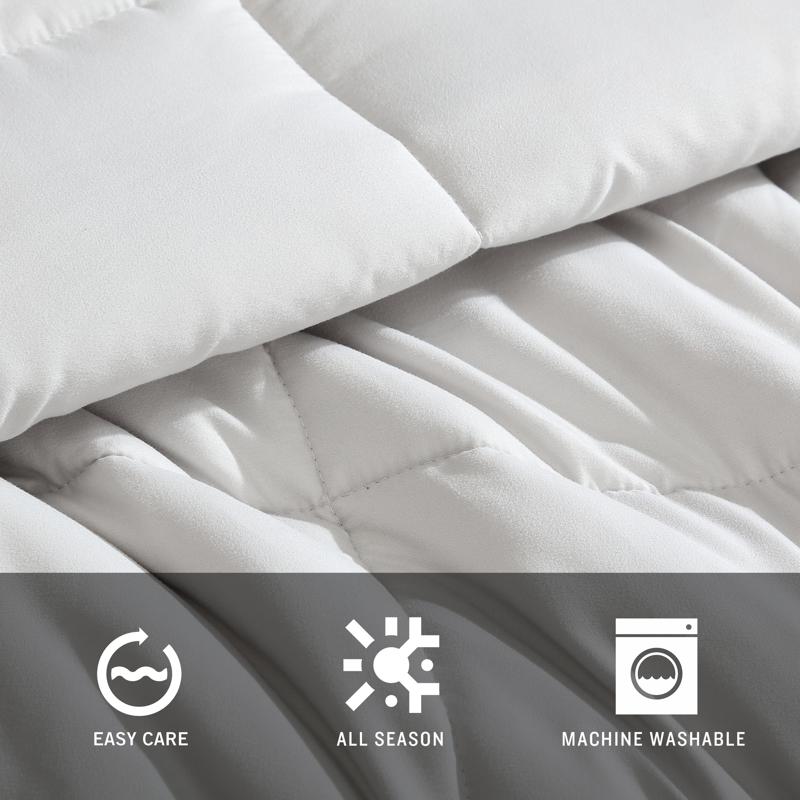 Reversible comforter showing light and dark grey tones.