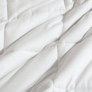 Reversible comforter showing light and dark grey tones.