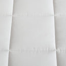 Reversible comforter showing light and dark grey tones.