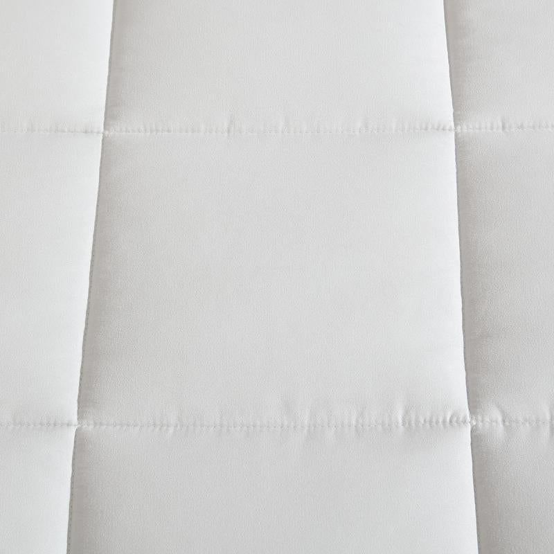 Reversible comforter showing light and dark grey tones.