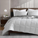 Reversible comforter showing light and dark grey tones.