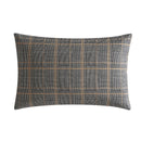 Kenneth Cole Sussex Khaki/Black Quilt Cover Set styled on bed with dark navy wall and wooden bedside table.