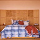 Bedroom styled with Lacoste L Denim Quilt Cover Set and rust accent cushions