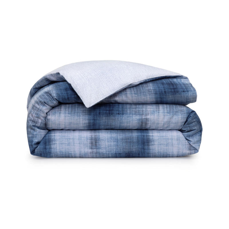 Bedroom styled with Lacoste L Denim Quilt Cover Set and rust accent cushions