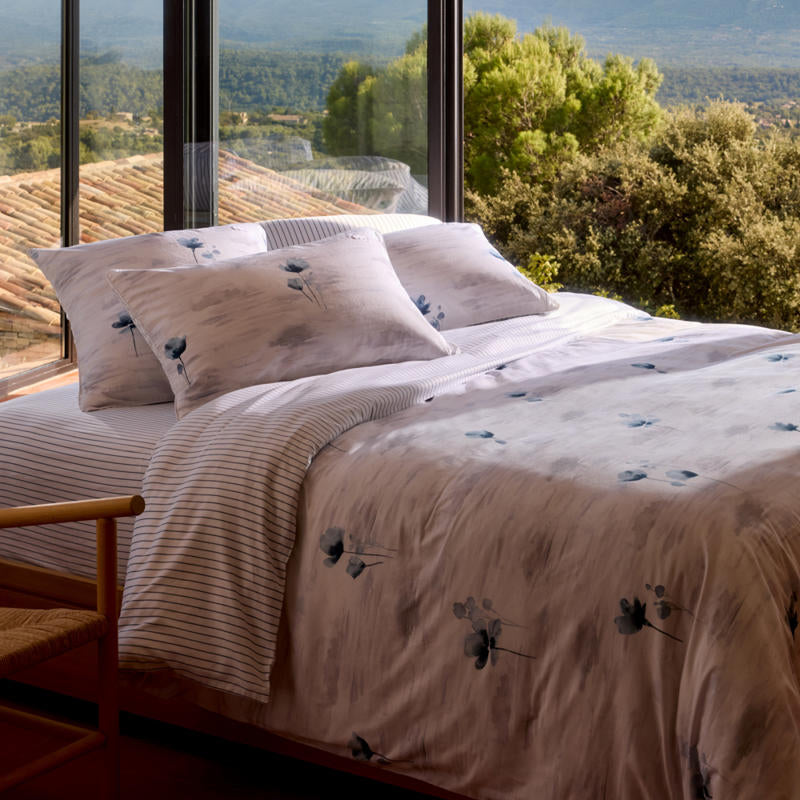 Bedroom styled with Lacoste L Shadow Quilt Cover Set in soft blue and grey tones