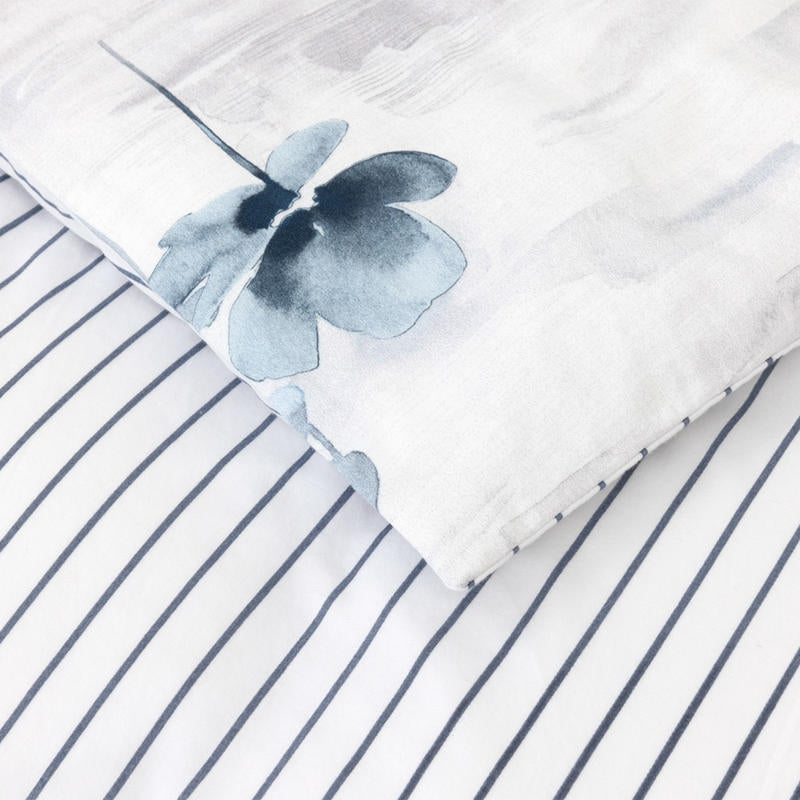 Bedroom styled with Lacoste L Shadow Quilt Cover Set in soft blue and grey tones