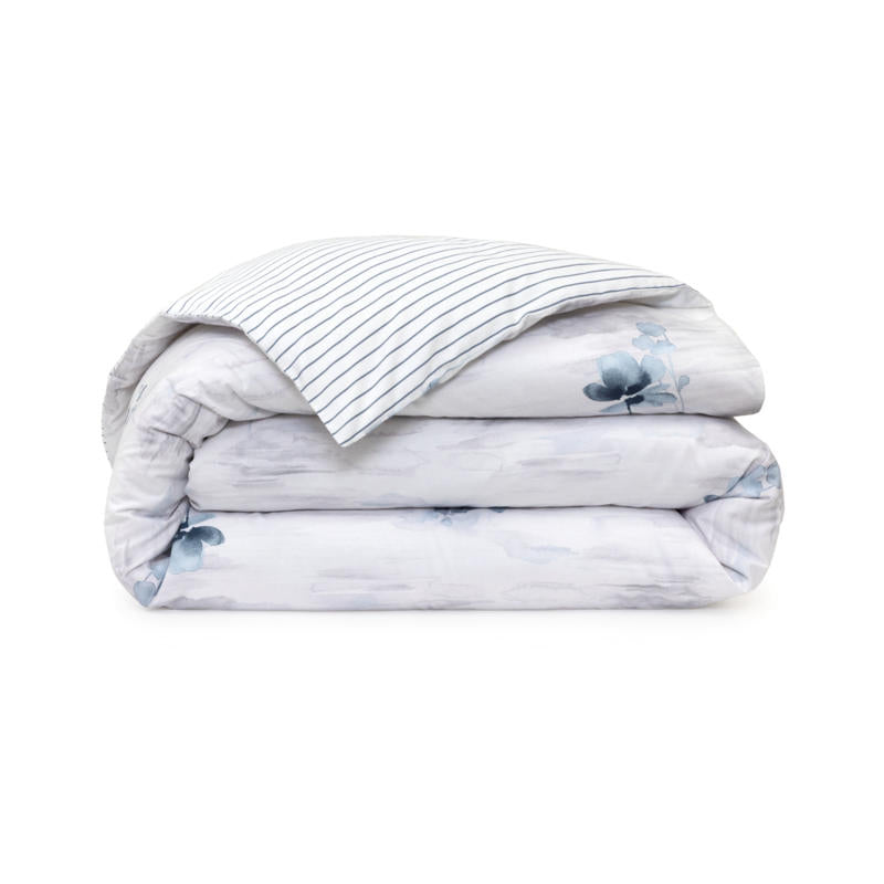 Bedroom styled with Lacoste L Shadow Quilt Cover Set in soft blue and grey tones