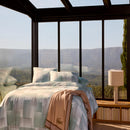 Bedroom styled with Lacoste L Songe Quilt Cover Set and neutral accent blanket.