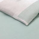 Bedroom styled with Lacoste L Songe Quilt Cover Set and neutral accent blanket.