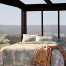 Bedroom styled with Lacoste L Songe Quilt Cover Set and neutral accent blanket.