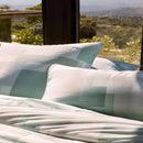 Bedroom styled with Lacoste L Songe Quilt Cover Set and neutral accent blanket.