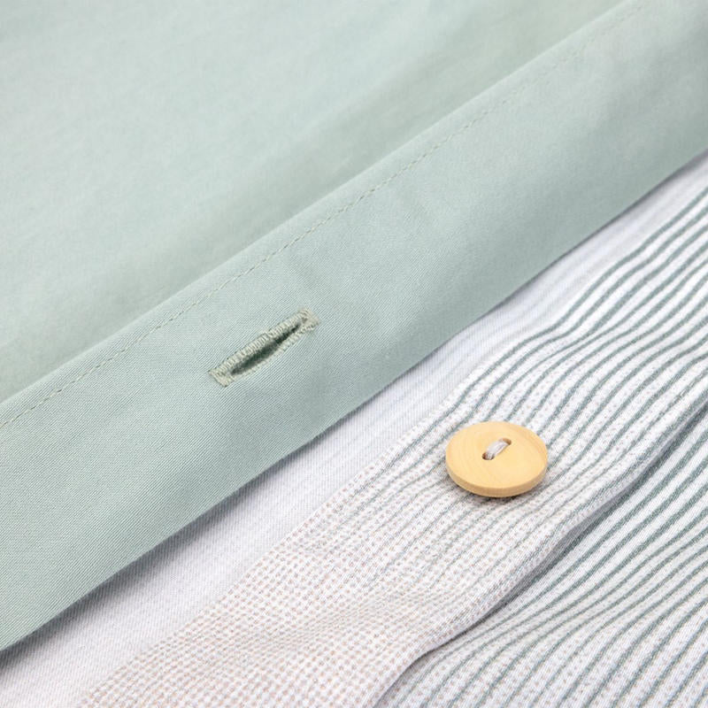 Bedroom styled with Lacoste L Songe Quilt Cover Set and neutral accent blanket.