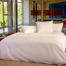 Bedroom styled with Lacoste L Tamis Blanc Quilt Cover Set and matching pillows