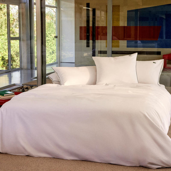 Bedroom styled with Lacoste L Tamis Blanc Quilt Cover Set and matching pillows