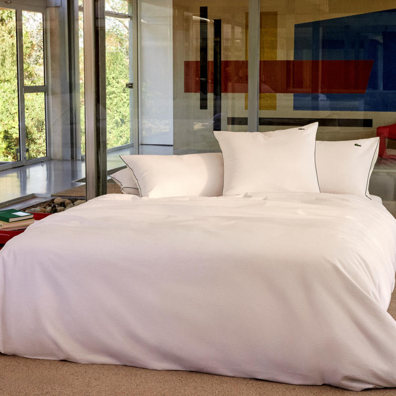 Bedroom styled with Lacoste L Tamis Blanc Quilt Cover Set and matching pillows