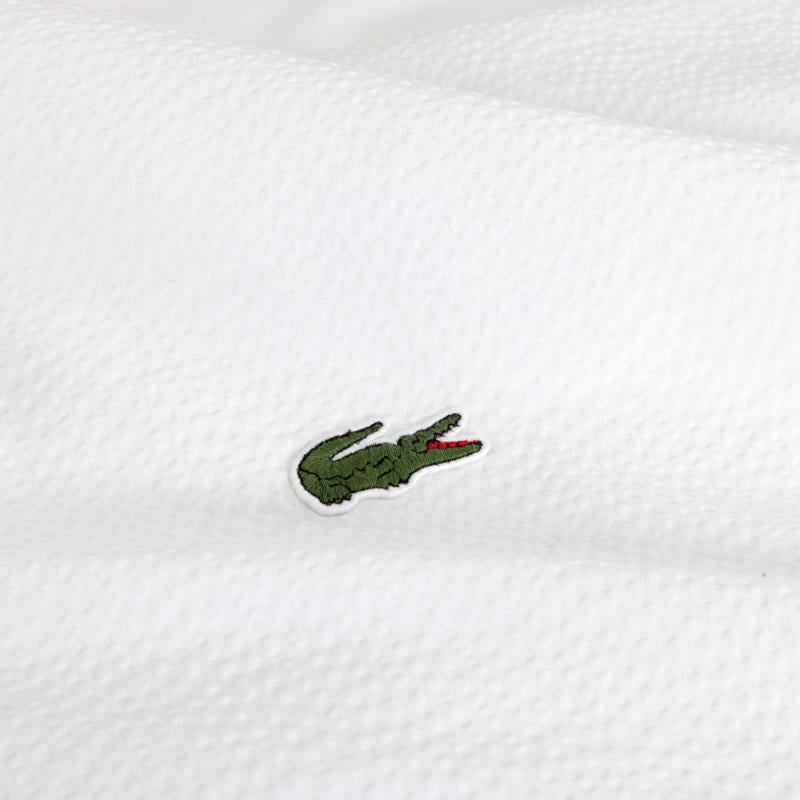 Bedroom styled with Lacoste L Tamis Blanc Quilt Cover Set and matching pillows