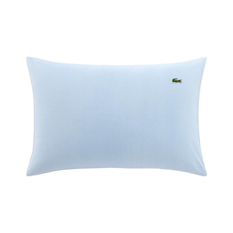 Close up of Lacoste L Tamis Sky Pillowcase texture and embroidered logo