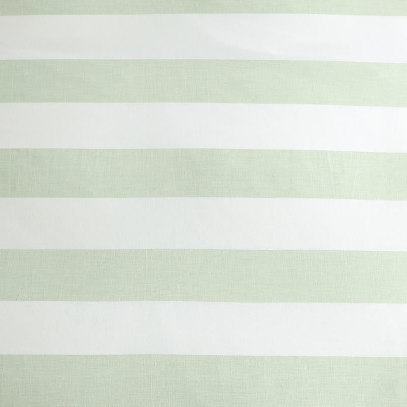 Coastal-inspired bedroom featuring Tommy Bahama Awning Stripe Sage bedding.