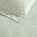 Reversible cotton quilt cover featuring light green and white leaf pattern.