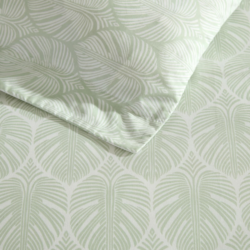 Reversible cotton quilt cover featuring light green and white leaf pattern.