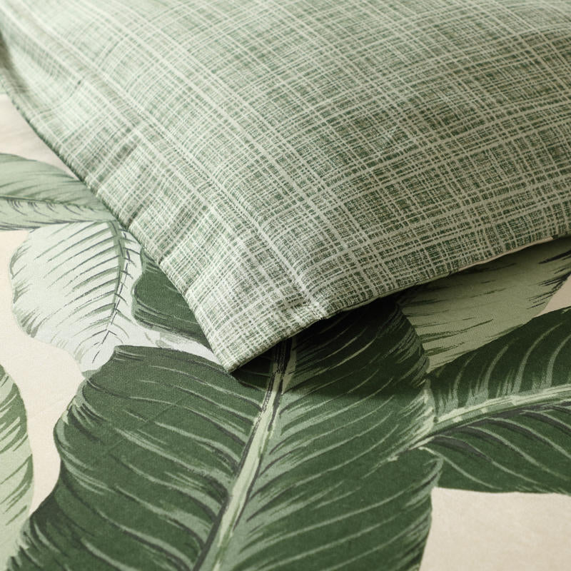 Tropical palm leaf quilt cover in soft, breathable cotton.