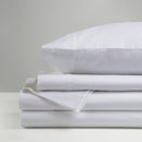 The Morgan and Reid Hotel 1500 Thread Count Cotton Rich Sheet Set, with pillowcases and one pillow on top, is neatly stacked and displayed against a plain light gray background.