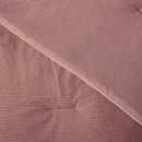 Close-up of a pink textured fabric with a diagonal pattern