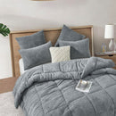 The Morgan and Reid Grey Spec Snuggle Fleece Pillowcase Pair features a modern speckled grey design and ultra-soft fleece, with slightly rounded corners, displayed on a plain white background.