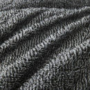 A rectangular, dark gray textured pillow is shown against a white background, ideal for cosy bedding. Pair it with the Morgan and Reid Black White Snuggle Fleece Pillowcase Pair for style and comfort.